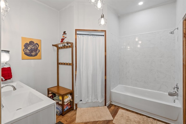 bathroom featuring shower / bath combo, sink, and hardwood / wood-style floors