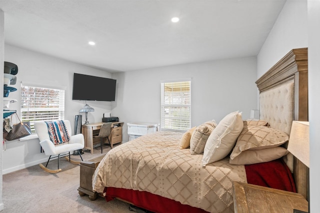 carpeted bedroom with multiple windows