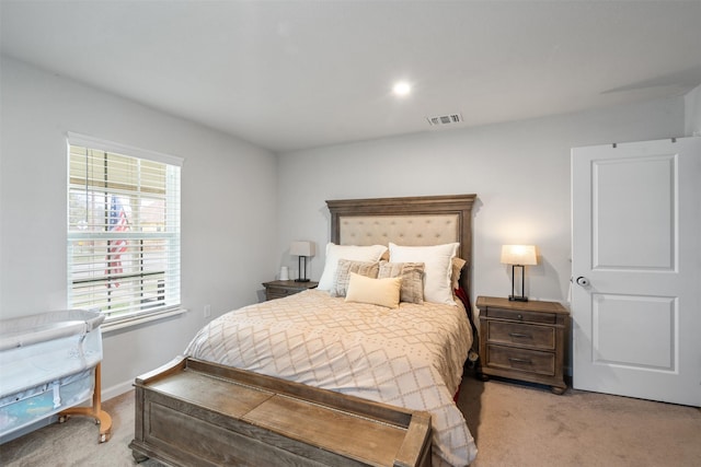 bedroom with light colored carpet