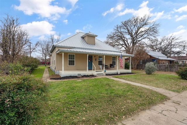 view of front of house with covered porch and a front yard