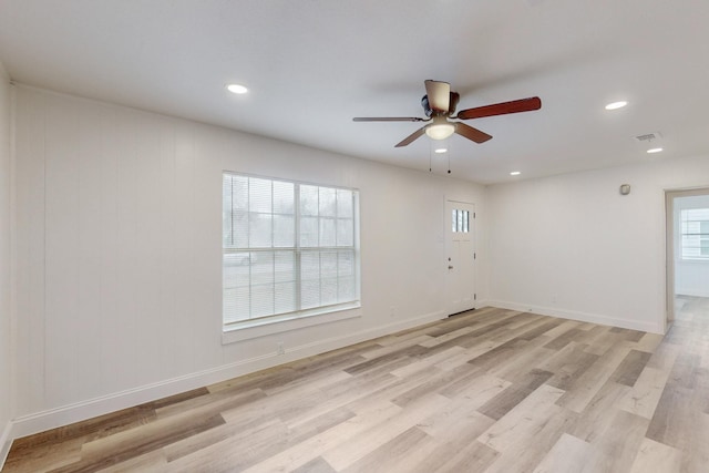 unfurnished room featuring ceiling fan and light wood-type flooring