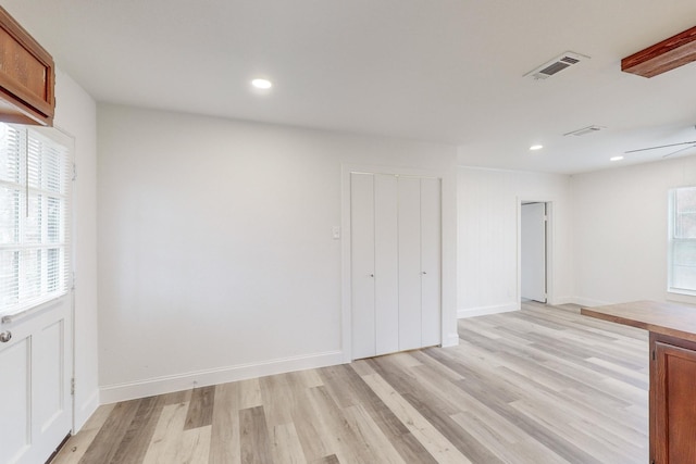 empty room with light hardwood / wood-style floors