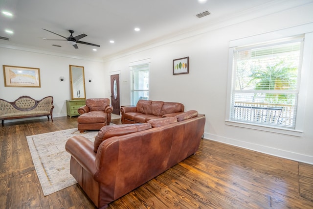 living room with ceiling fan, ornamental molding, and dark hardwood / wood-style flooring