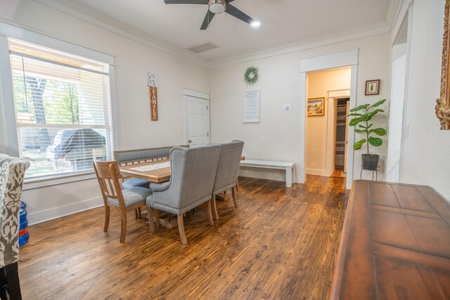 kitchen with a kitchen breakfast bar, sink, pendant lighting, dark hardwood / wood-style floors, and stainless steel electric range oven