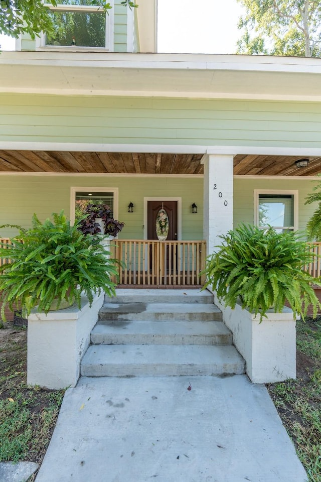 entrance to property with a porch