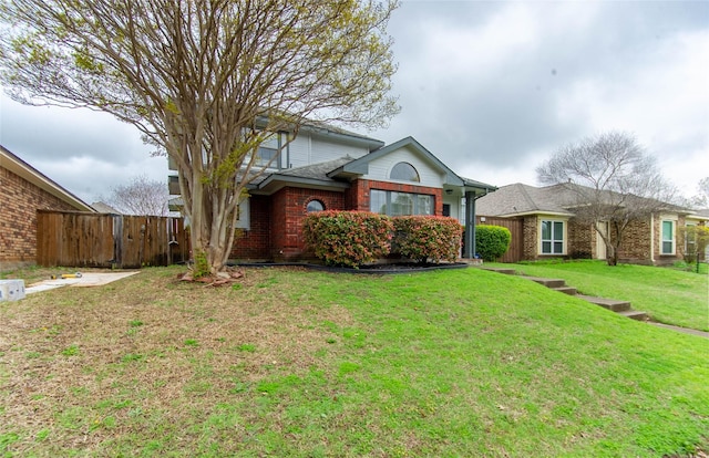 ranch-style house featuring a front yard