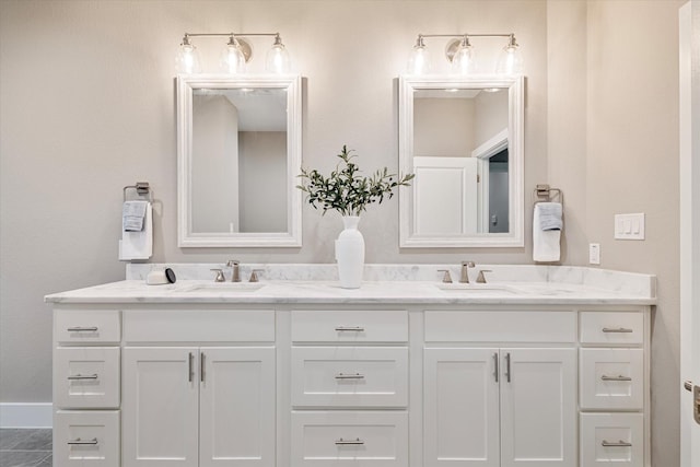 bathroom with tile patterned flooring and vanity