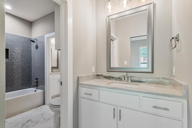 full bathroom with vanity, toilet, and tiled shower / bath