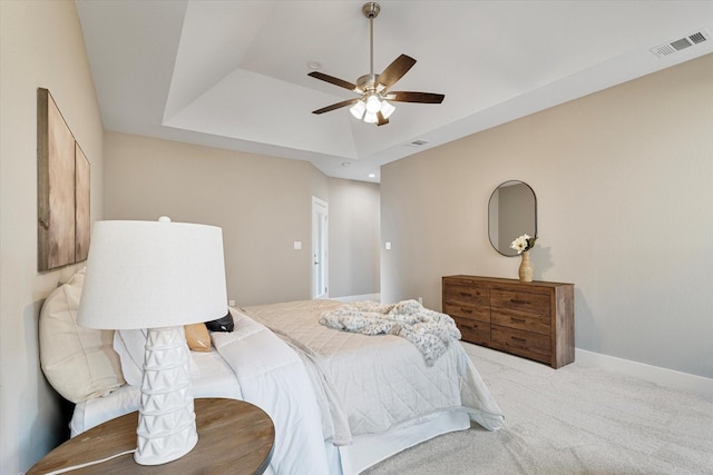 133 Pueblo Dr, Lake Kiowa, TX 76240 - bedroom featuring light colored carpet, a tray ceiling, baseboards, and a ceiling fan