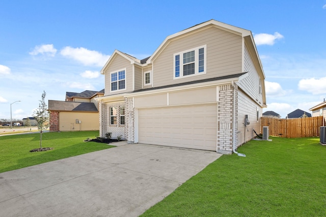 view of front of home with central AC, a garage, and a front yard