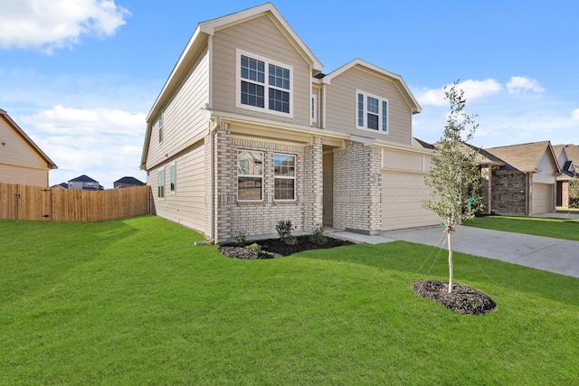 view of front of home featuring a garage and a front yard