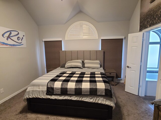 carpeted bedroom with vaulted ceiling