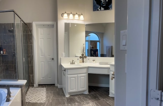 bathroom featuring vanity and shower with separate bathtub