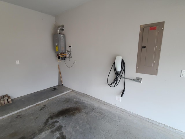 garage featuring electric panel and water heater