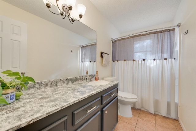 bathroom featuring a textured ceiling, vanity, an inviting chandelier, tile patterned flooring, and toilet