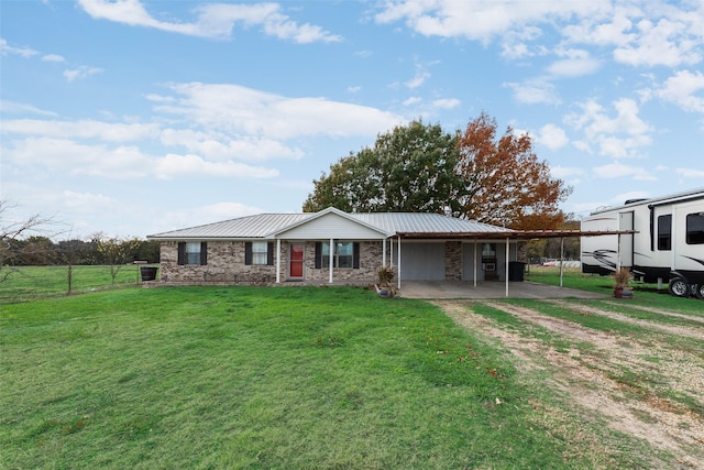 view of front facade with a carport and a front lawn