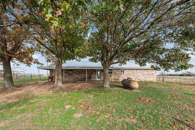 view of yard featuring a rural view and a carport