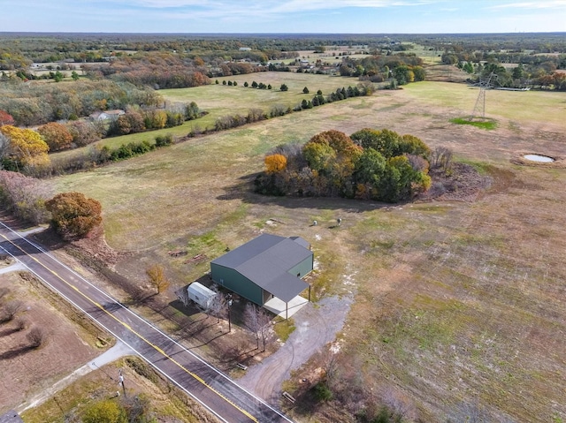 birds eye view of property with a rural view