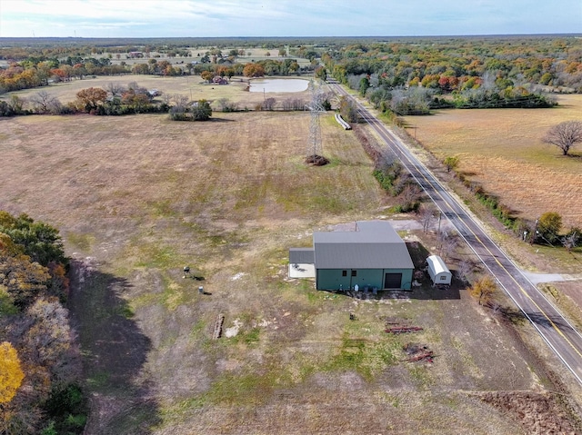 birds eye view of property featuring a rural view