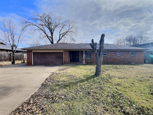 ranch-style home with a garage, brick siding, fence, driveway, and a front yard