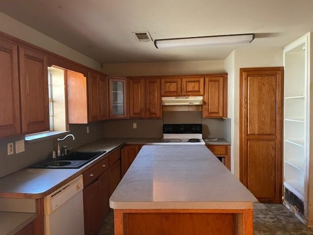 kitchen featuring under cabinet range hood, electric range, a sink, dishwasher, and brown cabinetry