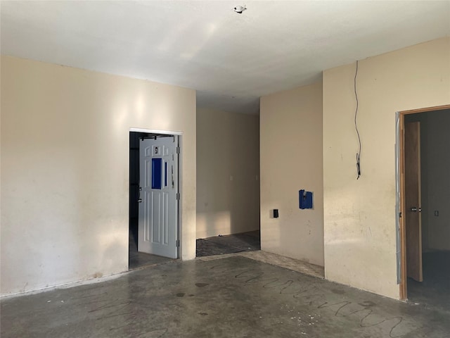 spare room featuring concrete flooring