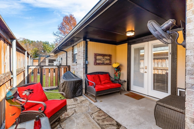 view of patio / terrace featuring a grill and french doors