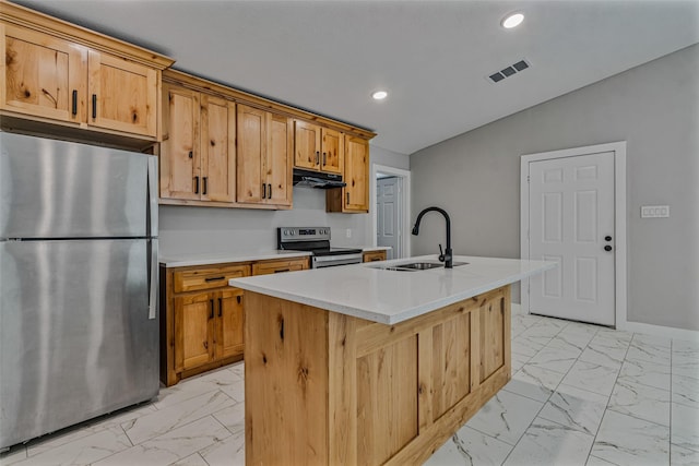 kitchen with a sink, marble finish floor, stainless steel appliances, under cabinet range hood, and visible vents