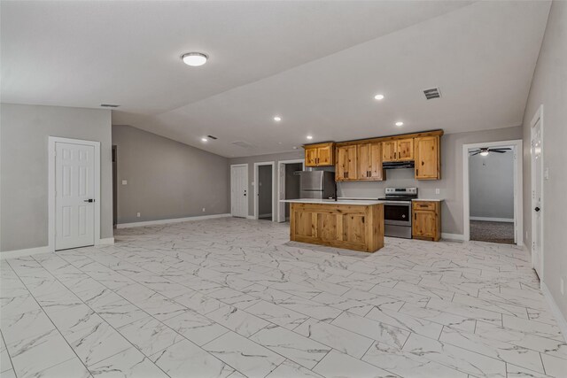 kitchen with a kitchen island, appliances with stainless steel finishes, light countertops, baseboards, and open floor plan