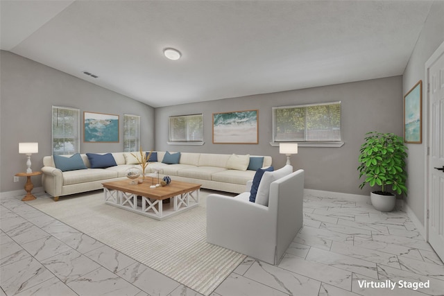 living area with baseboards, visible vents, plenty of natural light, and marble finish floor
