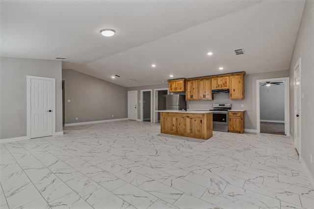 kitchen with ceiling fan, appliances with stainless steel finishes, a center island, vaulted ceiling, and exhaust hood