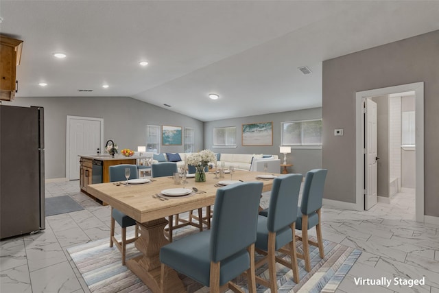 dining area featuring baseboards, marble finish floor, visible vents, and vaulted ceiling