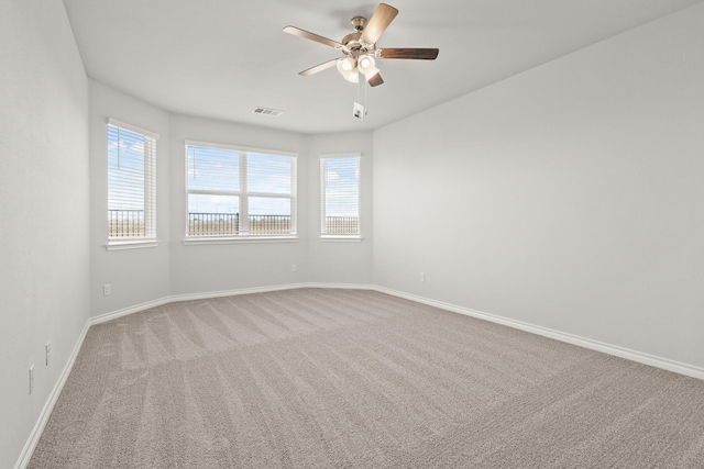 carpeted empty room with ceiling fan