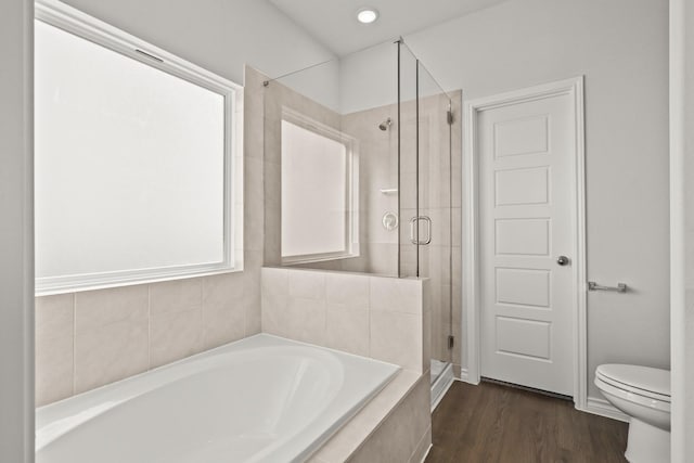 bathroom with independent shower and bath, wood-type flooring, and toilet