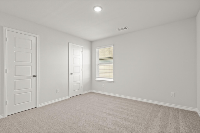 empty room featuring carpet floors