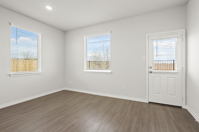 spare room featuring dark hardwood / wood-style floors