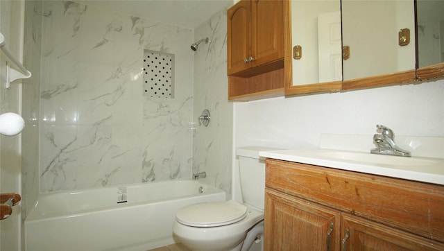 full bathroom with vanity, tiled shower / bath combo, and toilet