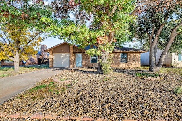 ranch-style home featuring a garage