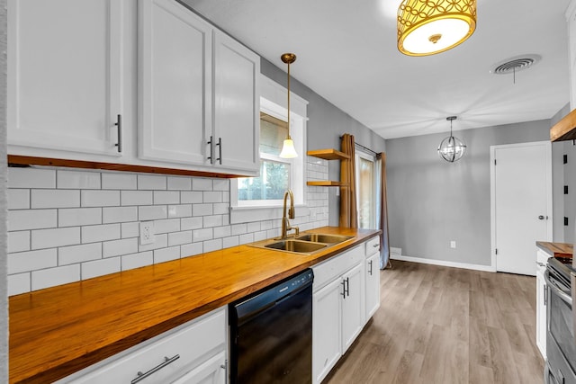 kitchen featuring wood counters, white cabinetry, pendant lighting, and black dishwasher