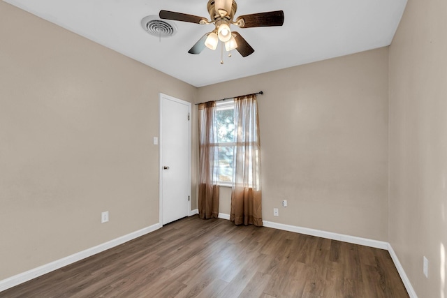 unfurnished room with hardwood / wood-style floors and ceiling fan