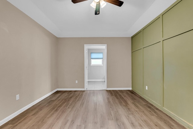 unfurnished bedroom featuring light hardwood / wood-style floors and ceiling fan