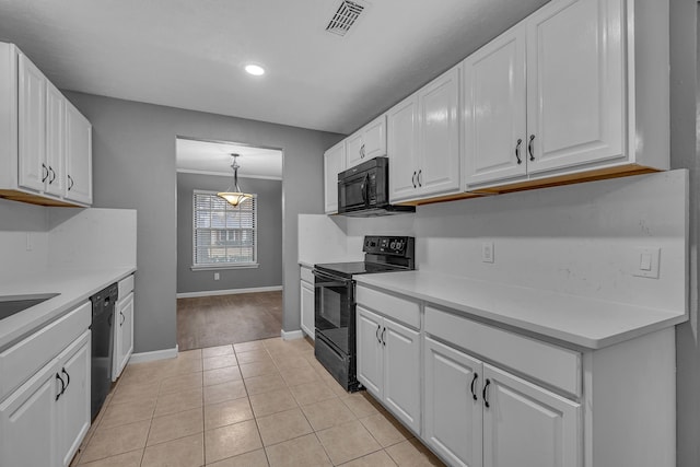 kitchen featuring black appliances, light tile patterned flooring, and white cabinets