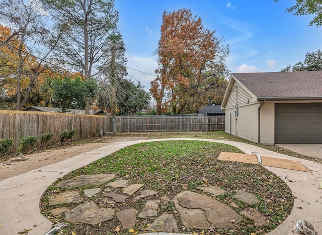 view of yard featuring a garage