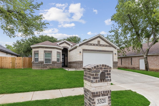 view of front of home featuring a front yard and a garage