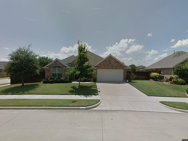 view of front facade featuring a front yard and a garage