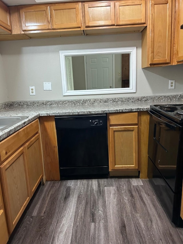 kitchen with black appliances, light stone countertops, dark wood-type flooring, and sink