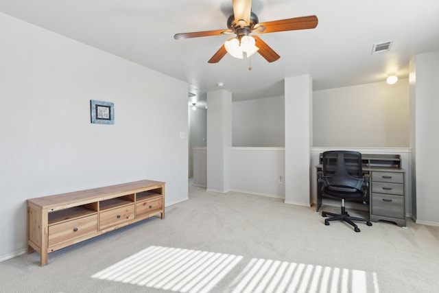 office space with ceiling fan and light carpet