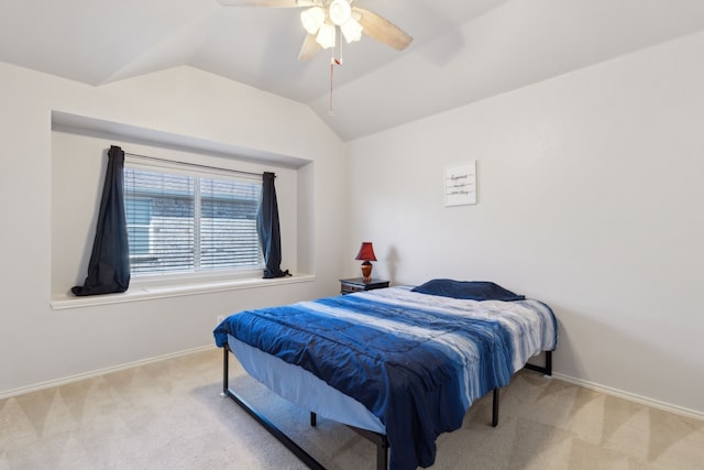 carpeted bedroom with ceiling fan and lofted ceiling