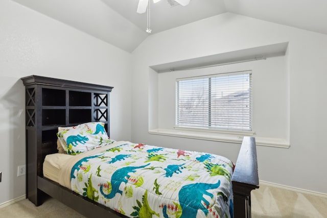 bedroom featuring ceiling fan, light carpet, and vaulted ceiling