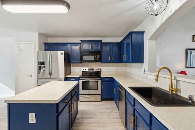 kitchen featuring light hardwood / wood-style flooring, stainless steel appliances, blue cabinets, and sink